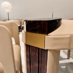 Upholstered-Leg Dining Table with Amber Burl Wood Top and Metal Accents